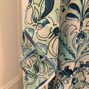 Poncho style. Body width 29 1/2 in, Long 25 1/2 in 100% poly.Machine wash cold.